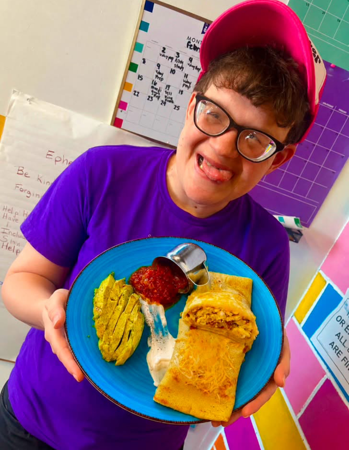 Shining Star holding a breakfast crepe plate with salsa