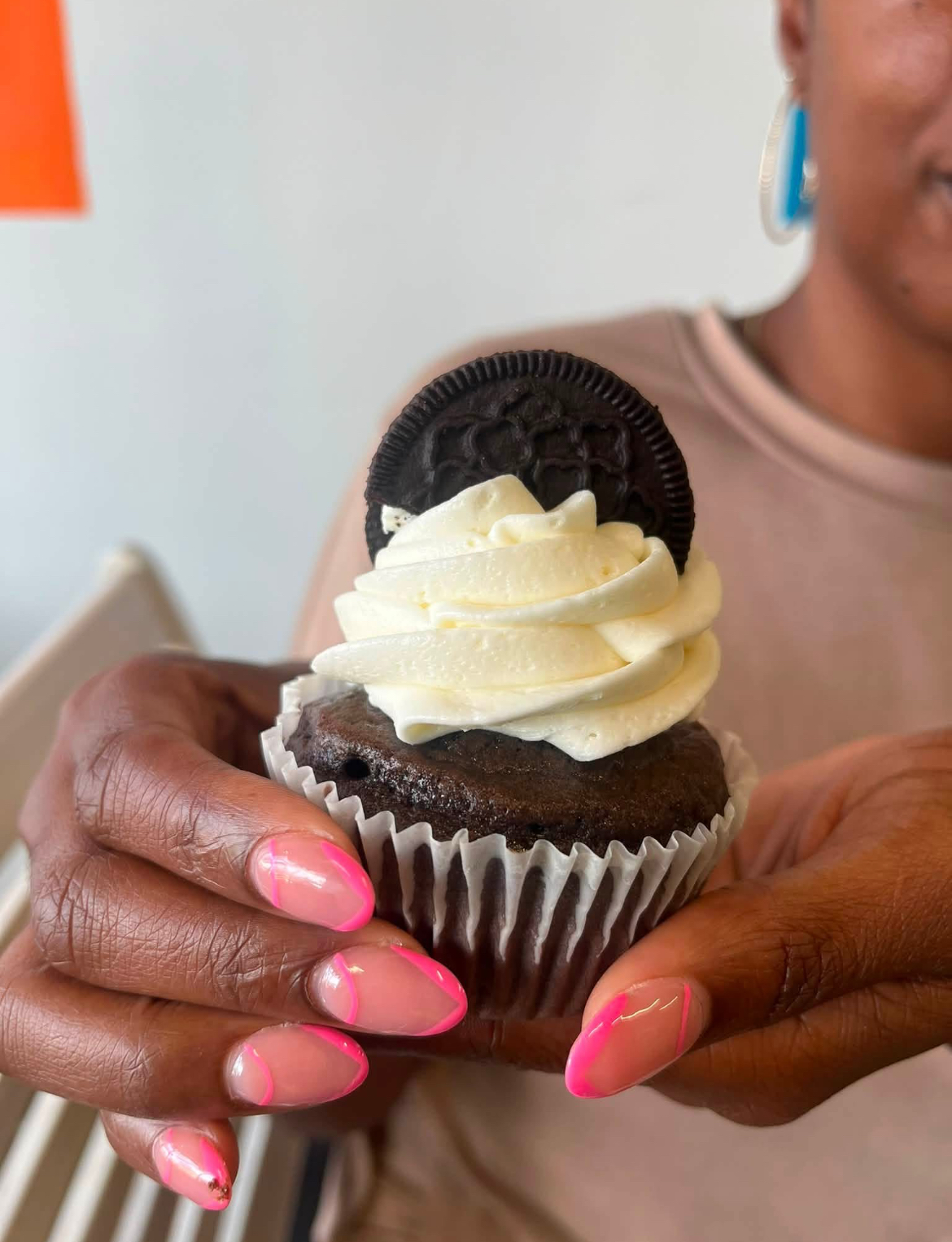 Cookies and cream cupcake topped with an Oreo