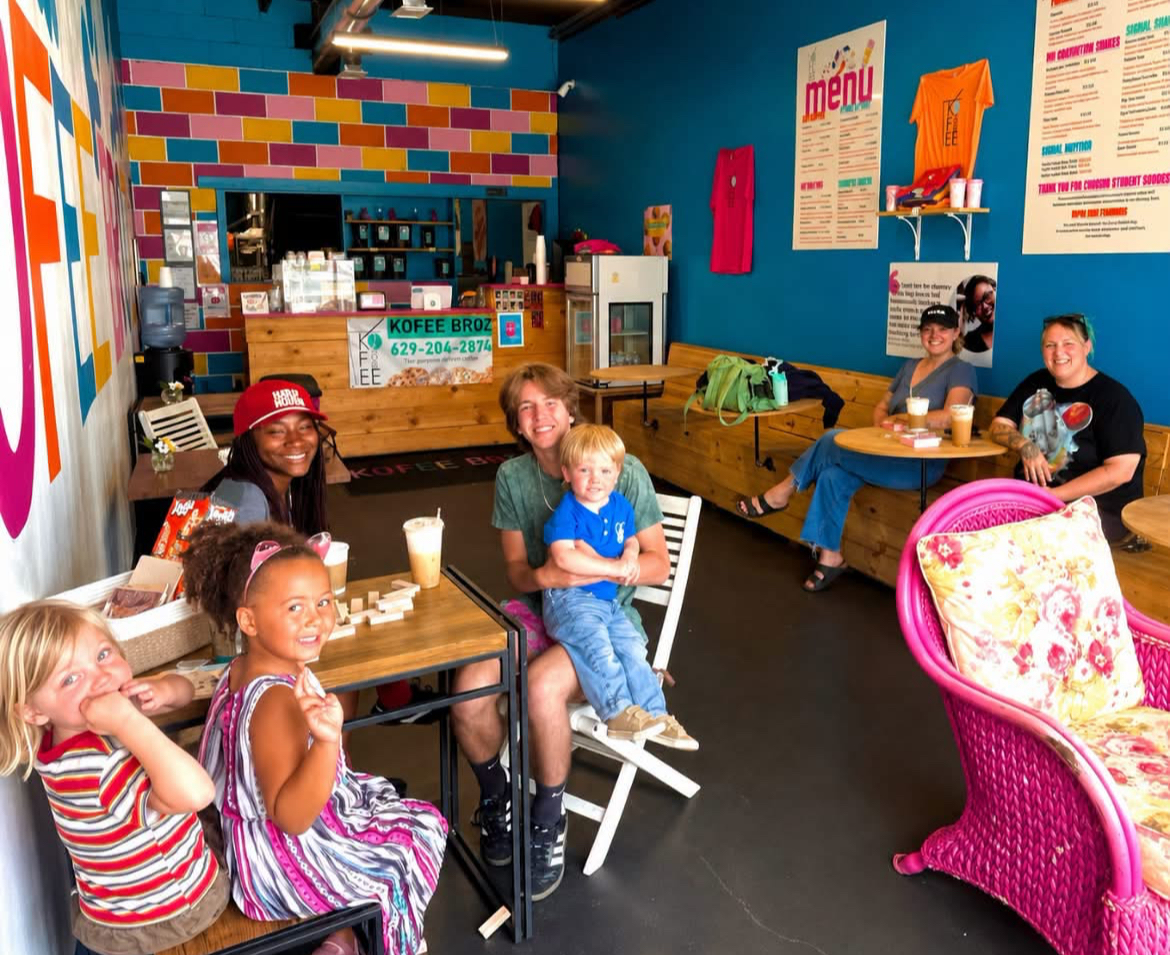Families hanging out in the colorful Kofee Broz cafe